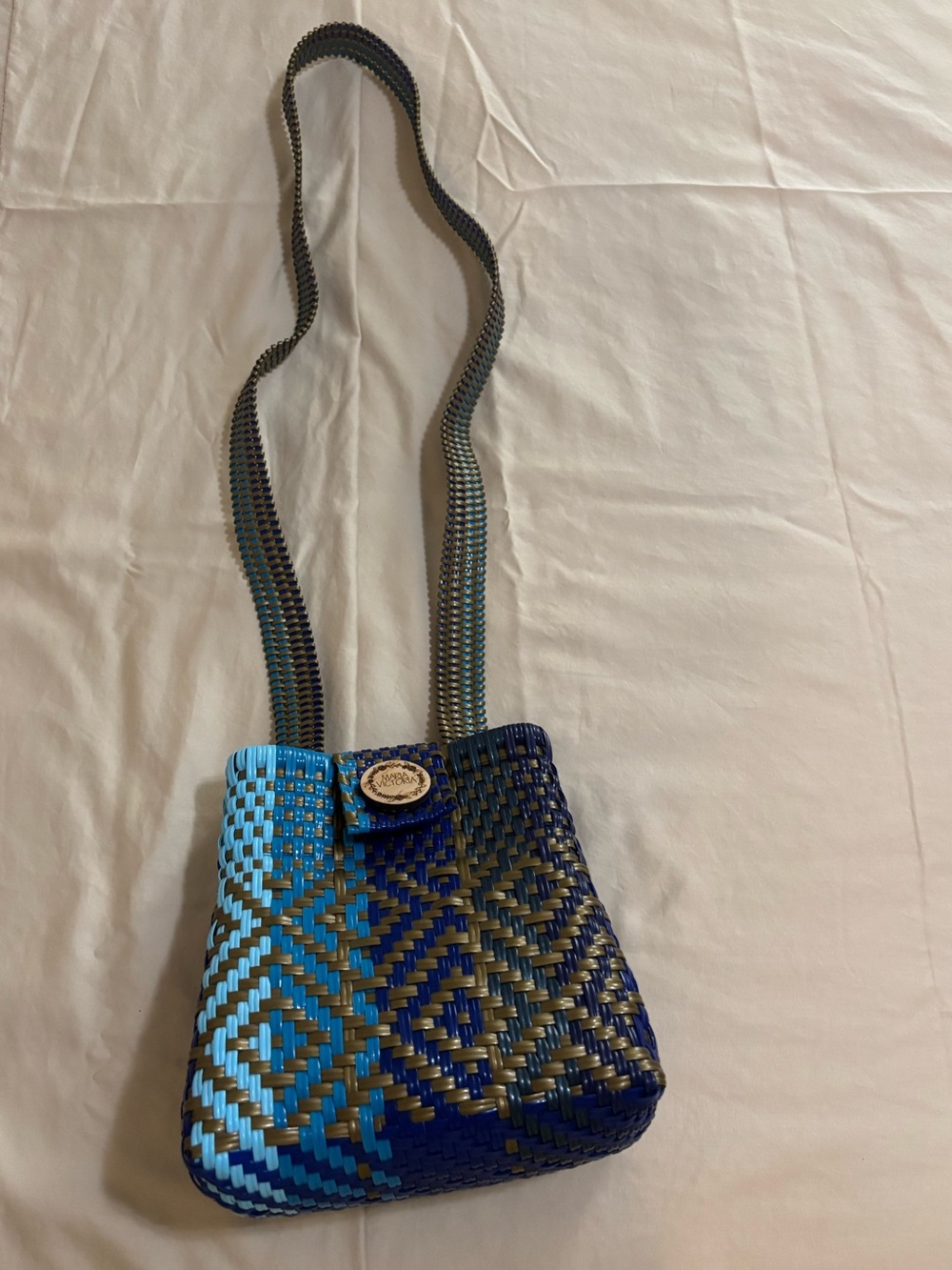 Maria Victoria handwoven tote bag is crafted from recycled plastic